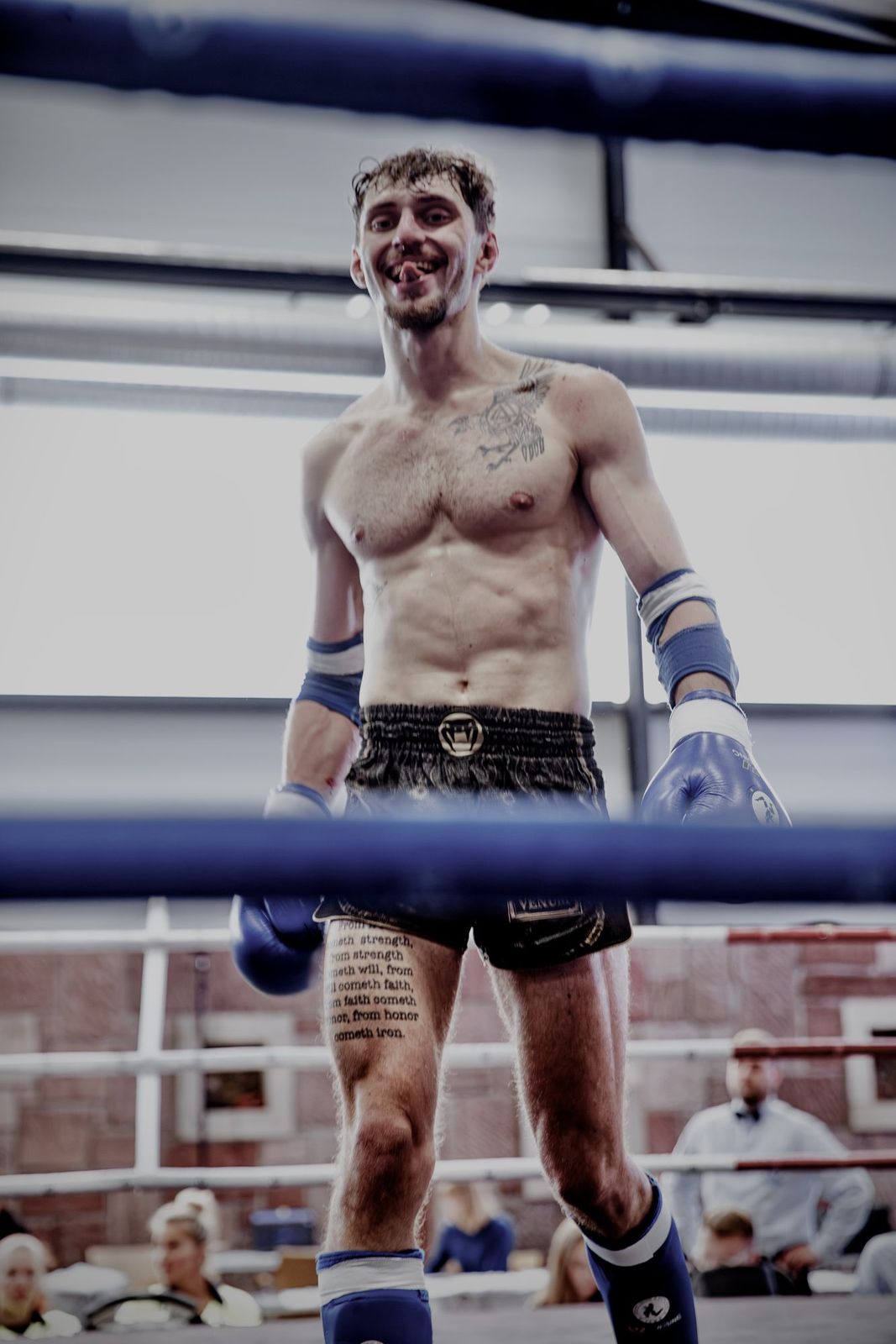 Robin Knápek, the face of VYRON, smiling in the ring after a bout.